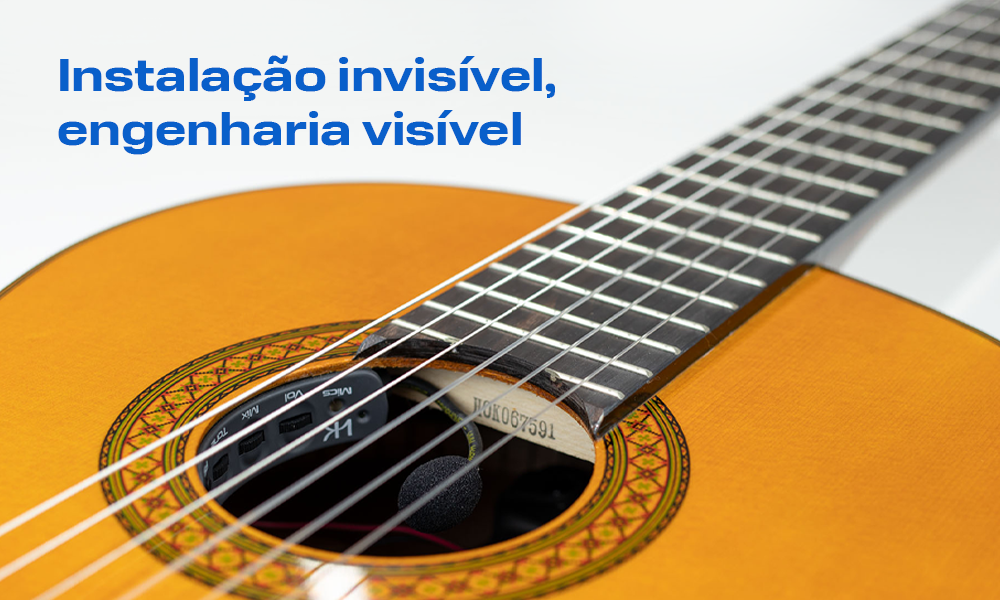 fotografia ilustrativa de um violão com o texto: instalação invisível, engenharia visível
